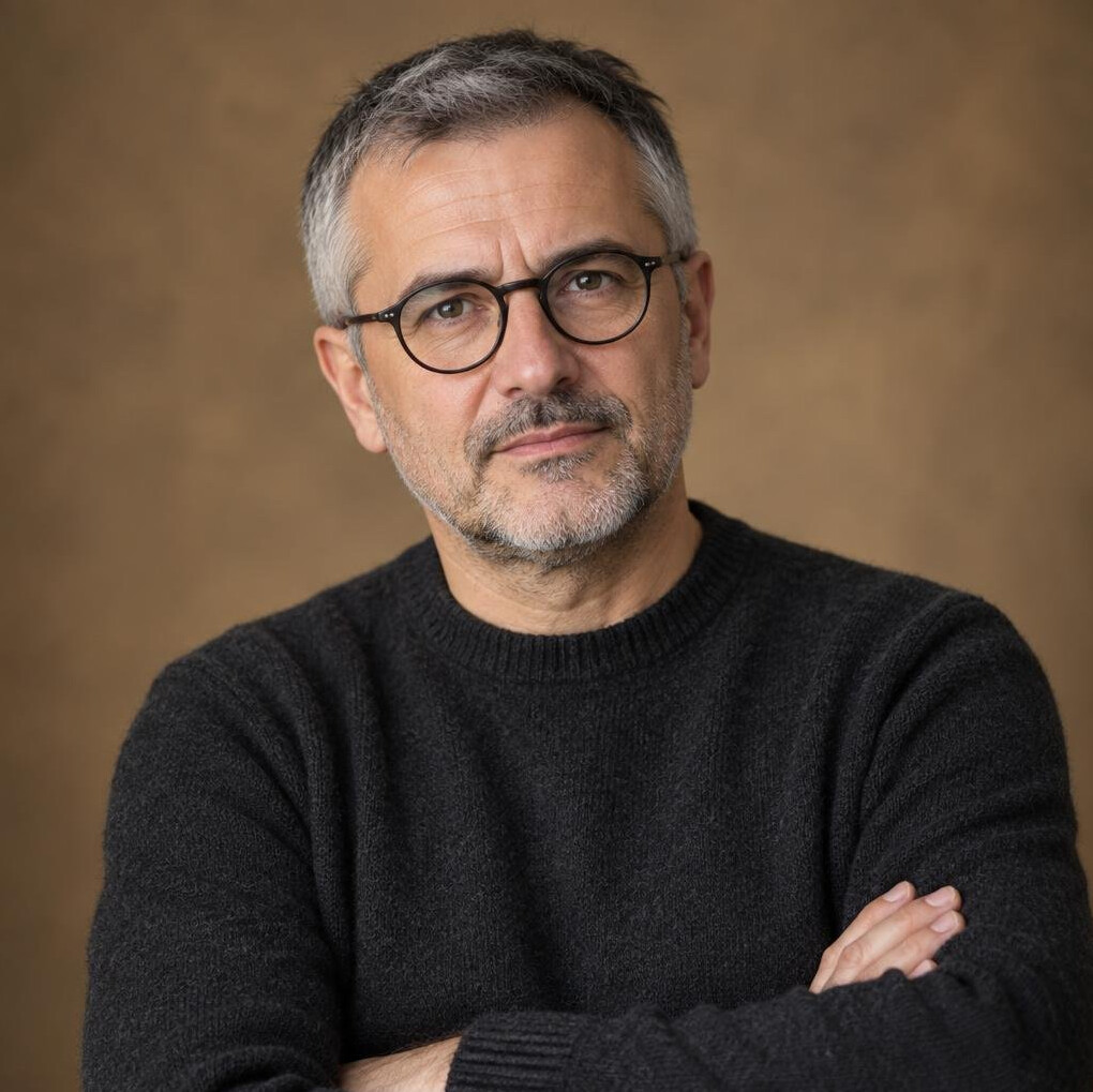Studio portrait of a middle-aged Croatian man writer with glasses